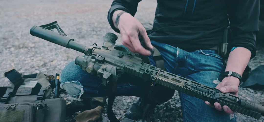 A man assembling Daniel Defense DDM4 V7 Rifle