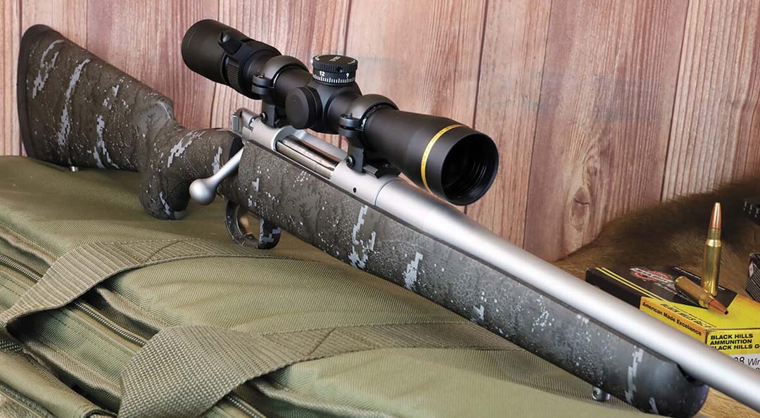 A Kimber Hunter Pro Desolve Blak rifle with attached scope