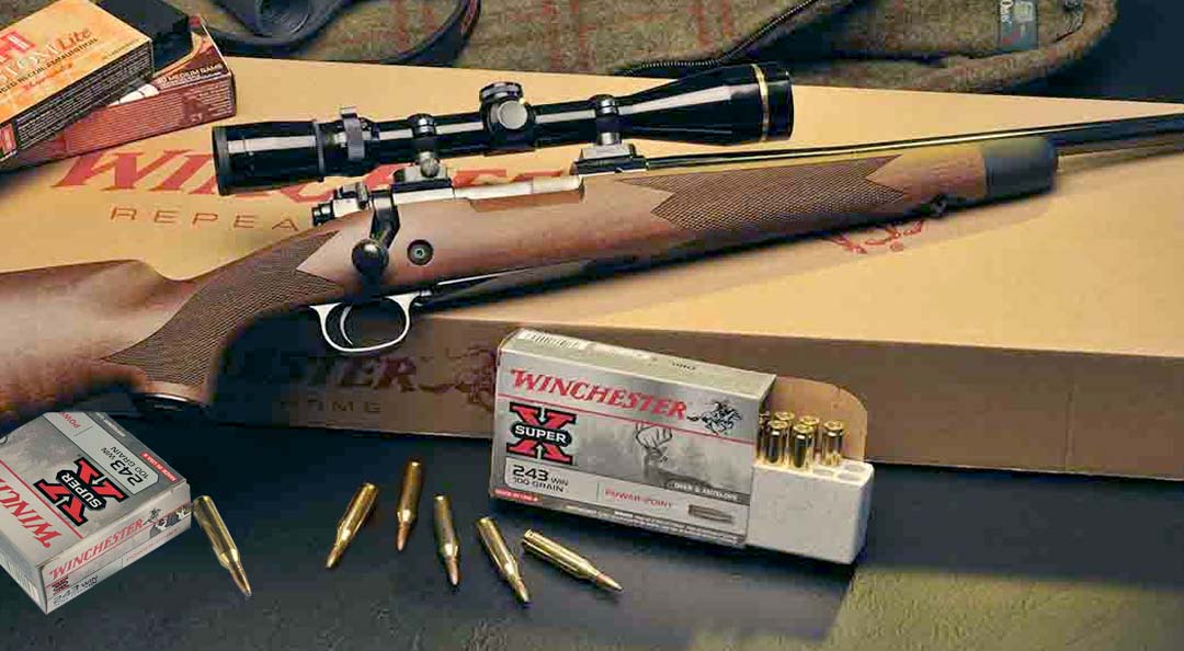 A brown Winchester Model 70 rifle with Super X Winchester ammunition lying around